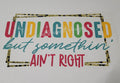 Undiagnosed But Somethin Ain't Right colorful retro quote with gold glitter leopard border shirt decal