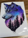 Galaxy Wolf Pine Forest Decal - majestic wolf with blue eyes blended with purple blue pink galaxy sky crescent moon and pine tree silhouettes
