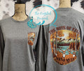 The Boys of Fall deer hunting front and back shirt decal shown on gray long sleeve shirt with autumn wilderness scene