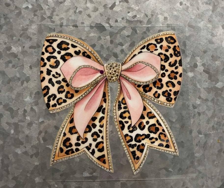 Leopard Print Rhinestone Bow - glamorous leopard print bow with soft pink ribbon center sparkling rhinestone knot and rhinestone trim edging