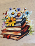 Wildflower Stack of Books Decal - vintage leather-bound books stacked with bright yellow sunflowers white and purple daisies blue flowers soft lilies and lavender sprigs overflowing from the top