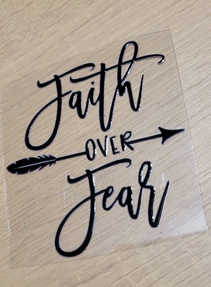 Faith Over Fear Feather Arrow Decal - bold elegant faith quote in beautiful script lettering with feather arrow through the word over