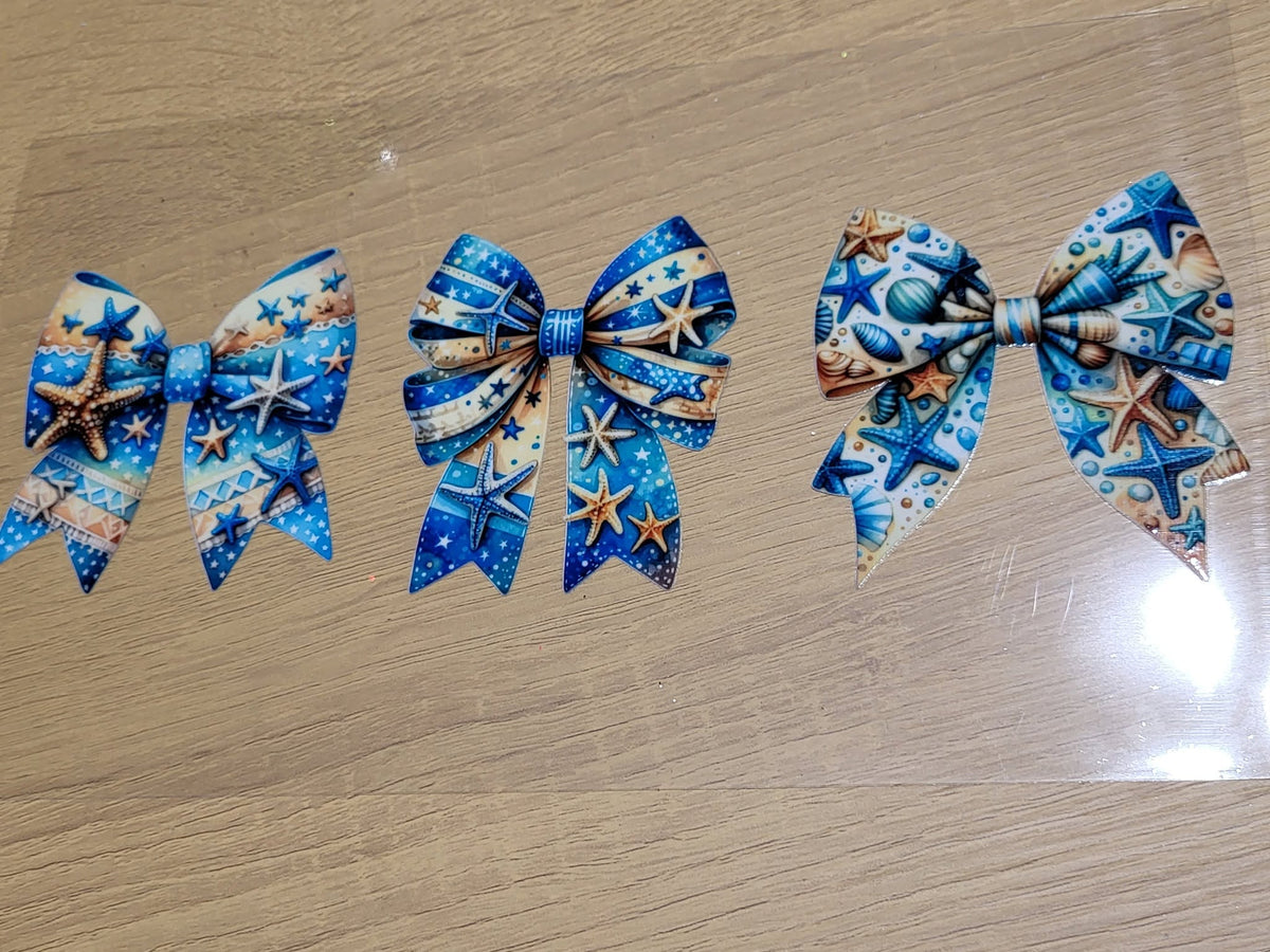 Ocean Coquette Bow Trio Starfish and Seashell Decal - three coquette bows in cream blue starfish stripes deep blue gold starfish swirls and colorful seashell bubble scatter patterns