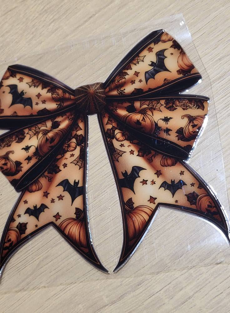 Halloween Bats Pumpkins Spiderweb Bow - large bow with bats jack-o-lanterns spiderwebs and stars on amber background with black edging Halloween accent piece