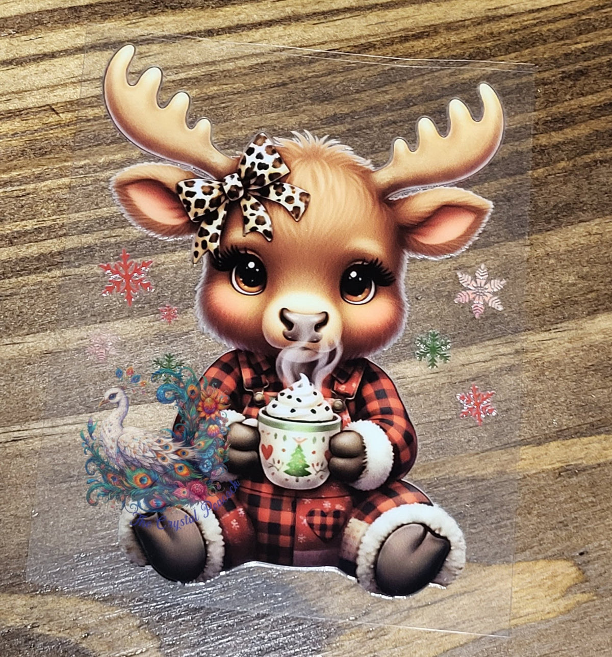 Baby Moose Hot Cocoa Christmas Decal - adorable baby moose with leopard bow in buffalo plaid pajamas holding steaming hot cocoa mug surrounded by colorful snowflakes