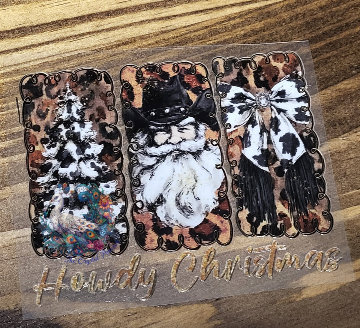 Howdy Christmas Western Santa - three leopard-framed panels with cowhide Christmas tree vintage cowboy Santa in black hat and cowhide fringe bow with gold Howdy Christmas script