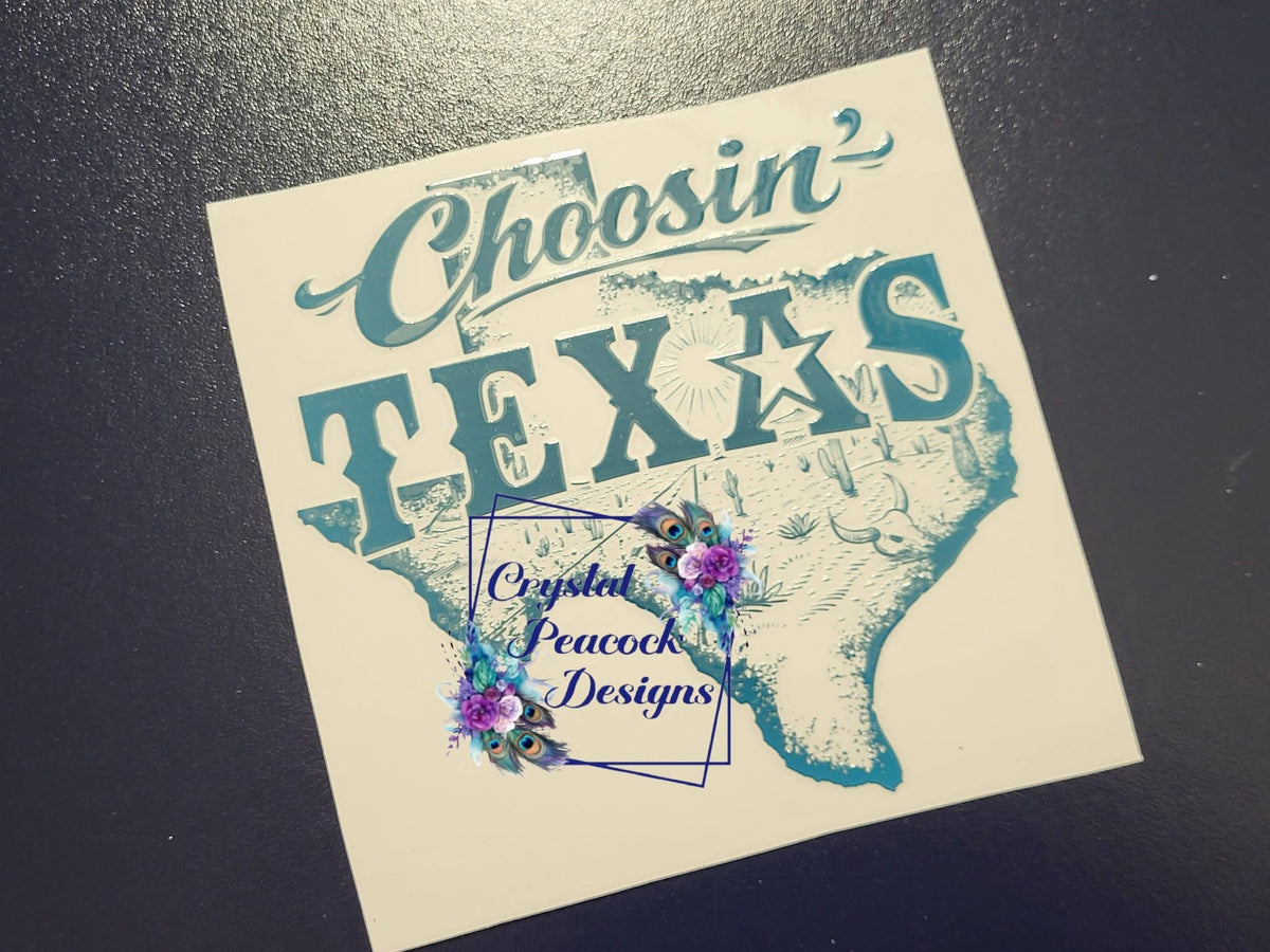 Choosin' Texas Decal - teal script and Texas state silhouette with lone star and desert landscape