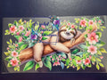 Smiling Sloth on Floral Branch Wrap Decal - content smiling sloth draped over branch surrounded by pink cherry blossoms and lush green leaves
