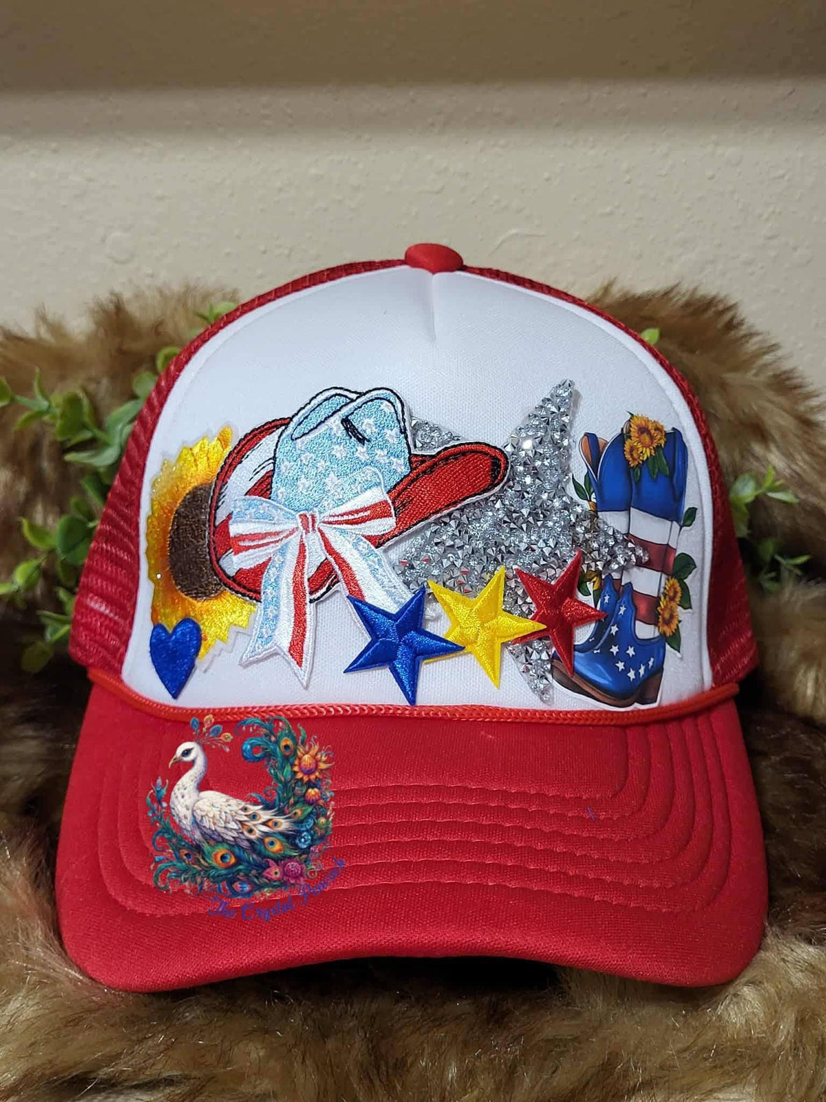 Hey Cowgirl Trucker Hat in red white and blue with cowgirl boots sunflowers and rhinestone stars
