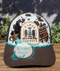 Mamas Don't Let Your Babies Grow Up To Be Cowboys Trucker Hat with cow print and embroidered patches