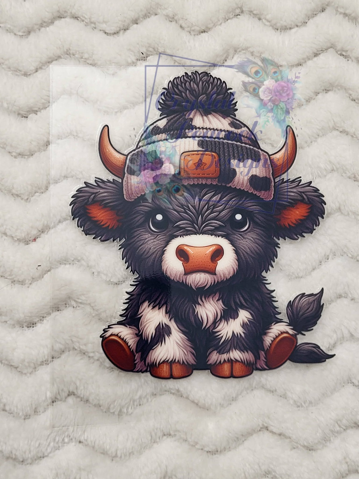 Highland Calf Cow Print Beanie Decal - dark fluffy highland baby calf with cow print pom-pom beanie and star patch