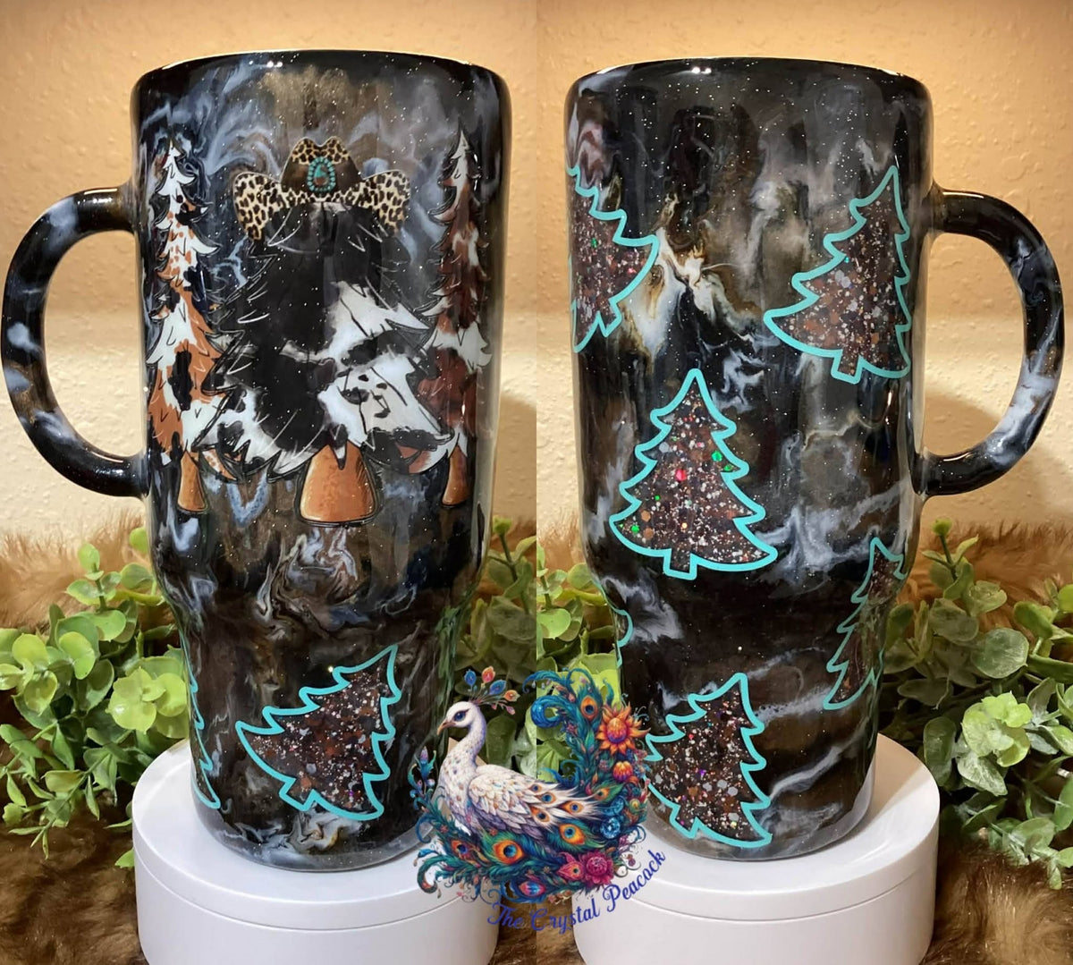 Western Christmas 32oz Handle Tumbler - Cowtown glitter peek-a-boo Christmas trees trimmed in teal with ink swirl base and western cow print Christmas tree decal