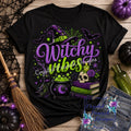 Witchy Vibes Halloween shirt decal with witch hat cauldron and spell books on black shirt