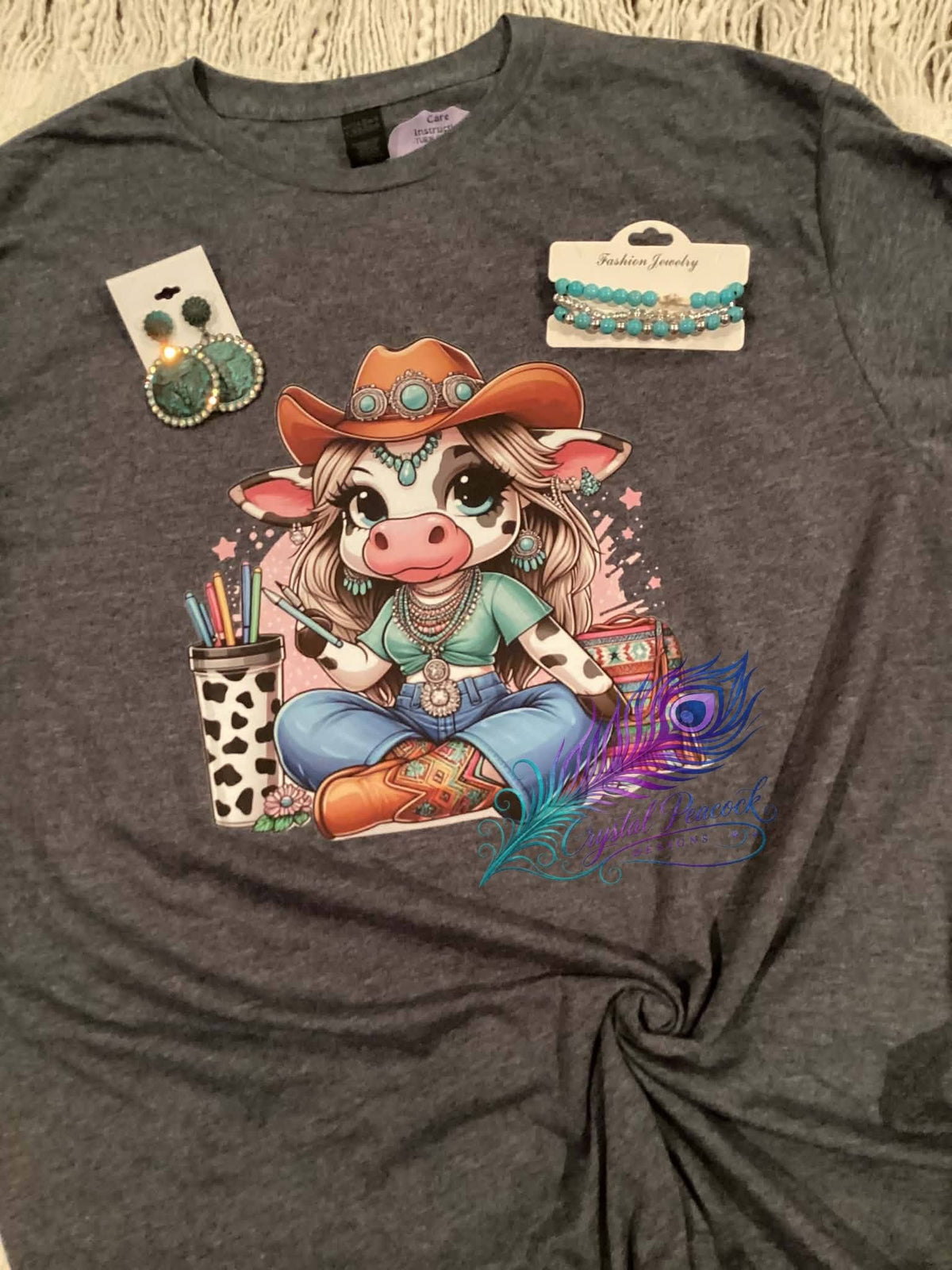 Cowgirl cow with turquoise accessories graphic tee
