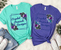 Crystal Peacock Designs logo t-shirt in teal and purple