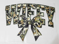 Wifey camo bow shirt decal with arched varsity lettering in green camo print and matching camo bow